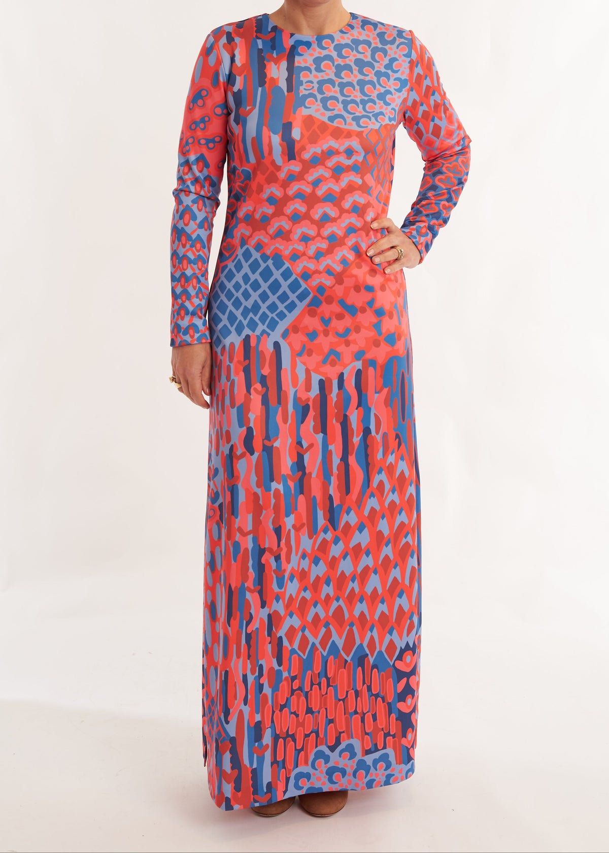 Long-sleeve dress with a colorful abstract pattern on a white background