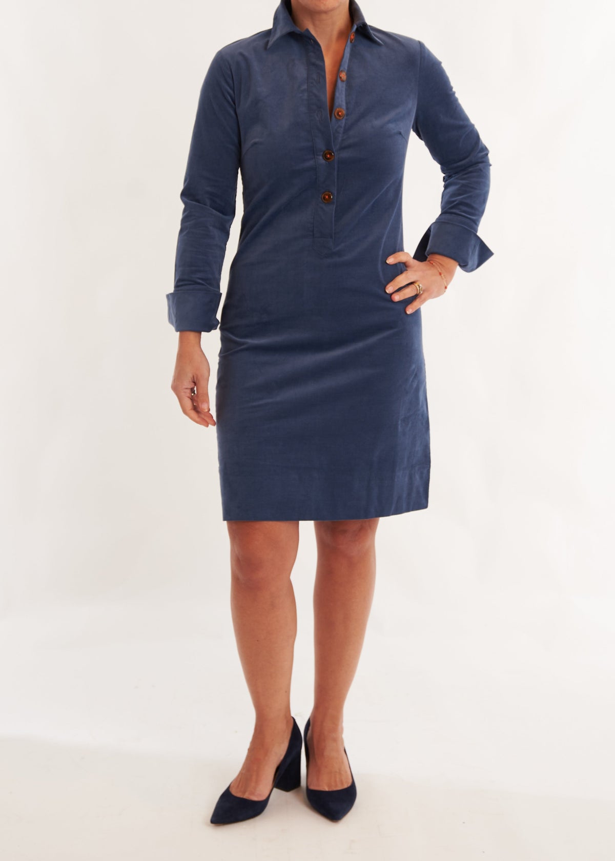 Person wearing a blue dress with a white background